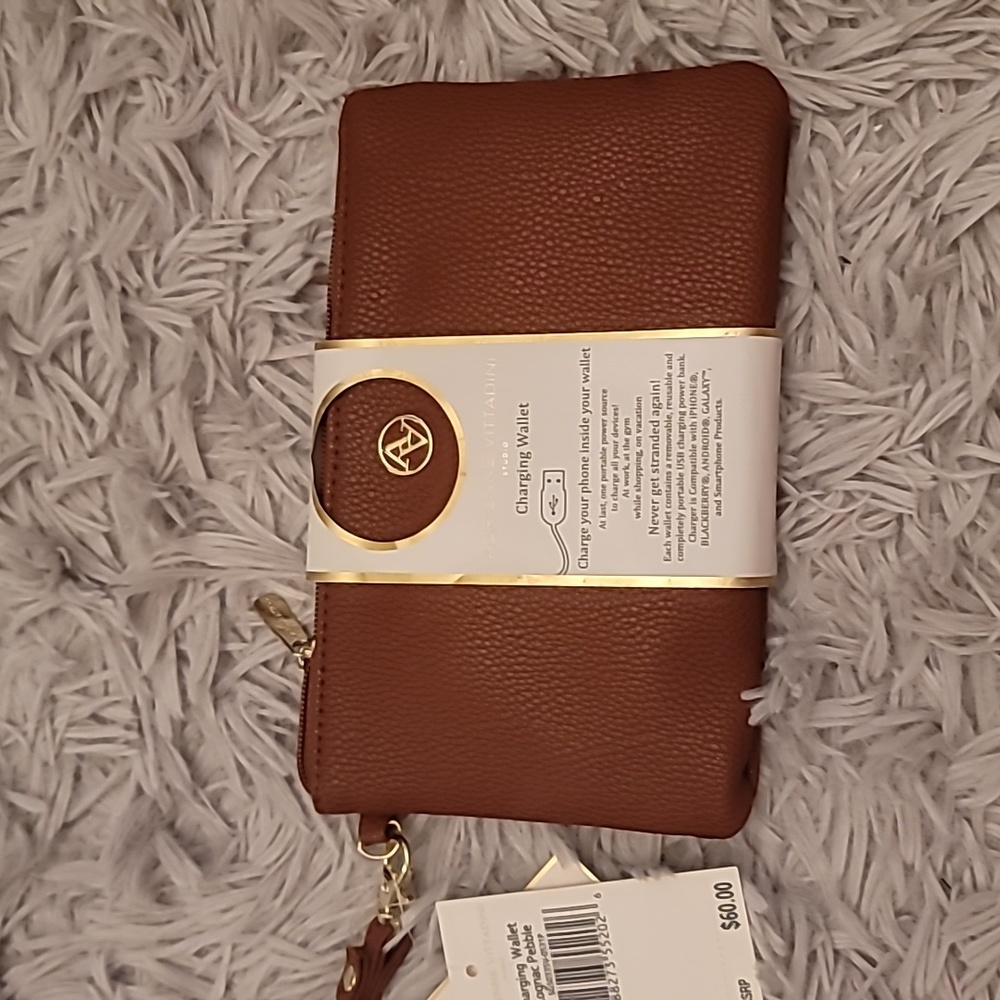Brand New Adrienne Vittadini charging wallet clutch.